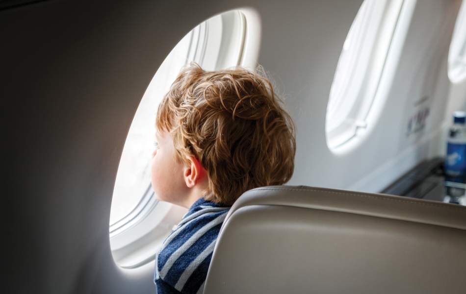 AirSprint child passenger looking outside of window