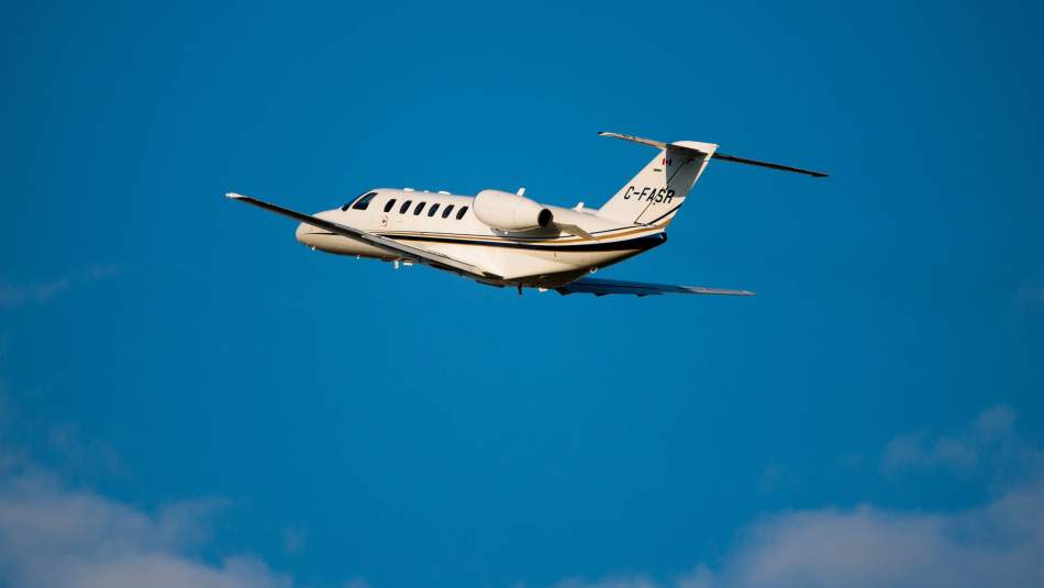 AirSprint CJ2+ plane flying away