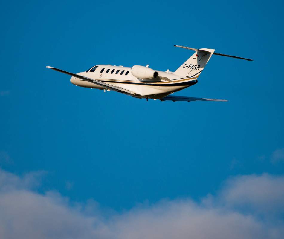 AirSprint CJ2+ plane flying away