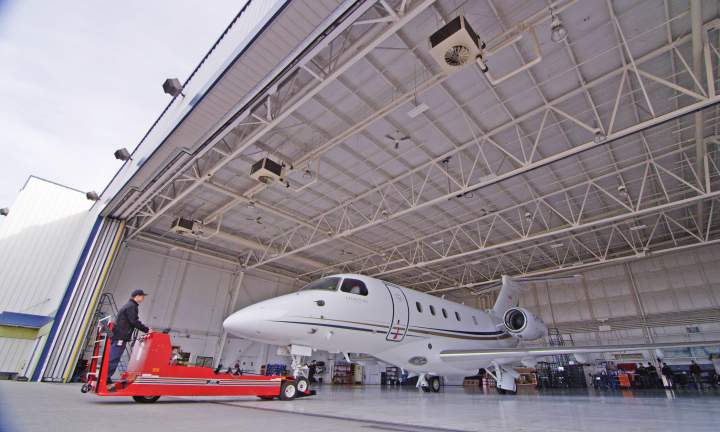 AirSprint Maintenance Team Taxiing Legacy 450 Out Of Hangar