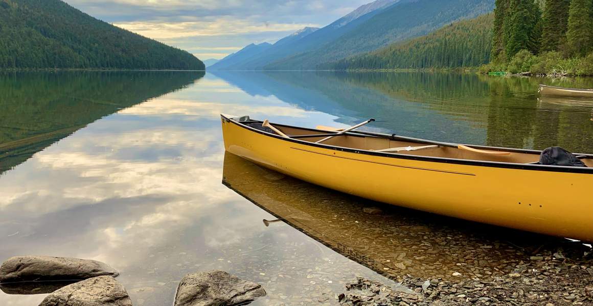 Canoe Resting on the Bowron Lake | Discover Vanderhoof, BC | AirSprint Private Aviation